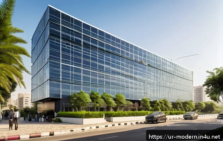 현대건축물 유리 파사드 기술 - A modern commercial building façade featuring large tempered glass panels with a sleek, transparent ...